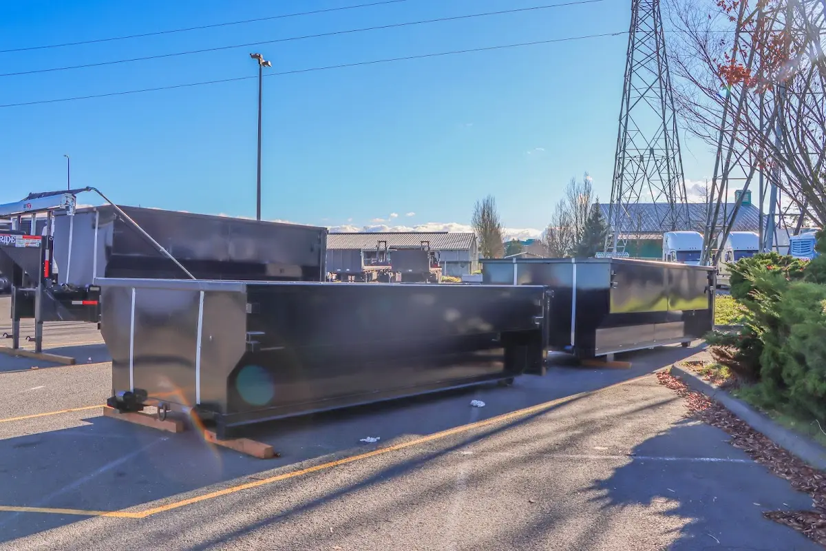 Roll-off dumpster ready for waste disposal at job site for Concrete Dumpster Rental in Littlefield